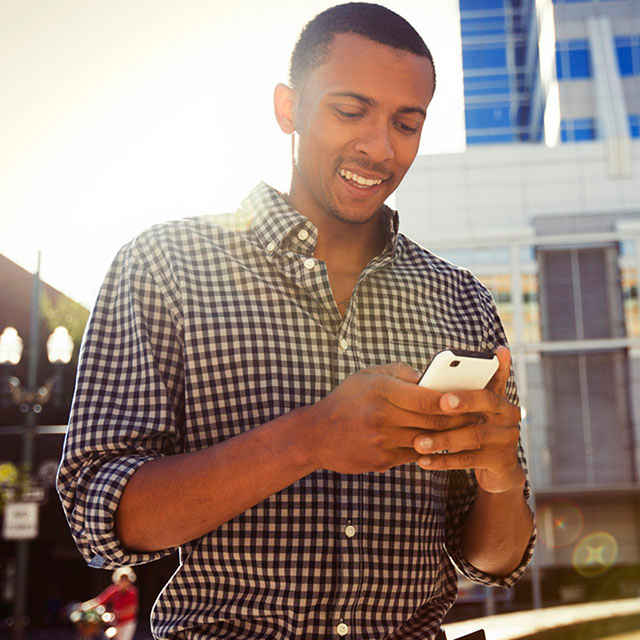 man looking at phone