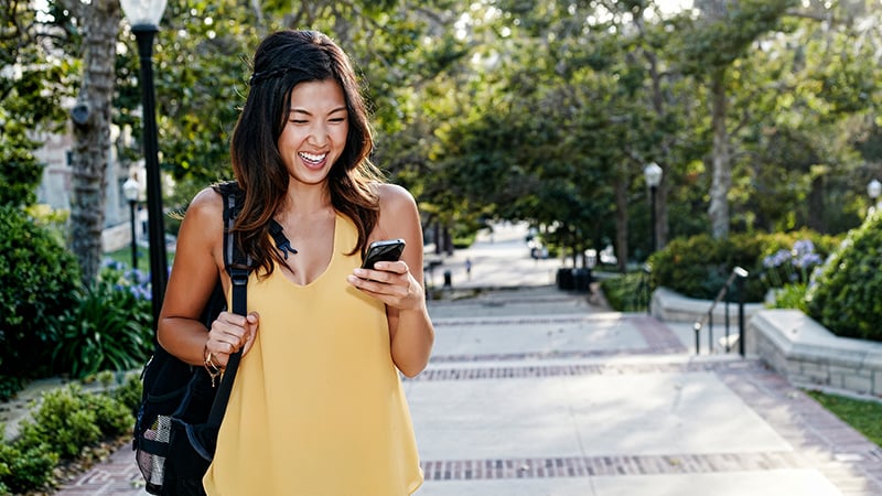 woman holding her smartphone